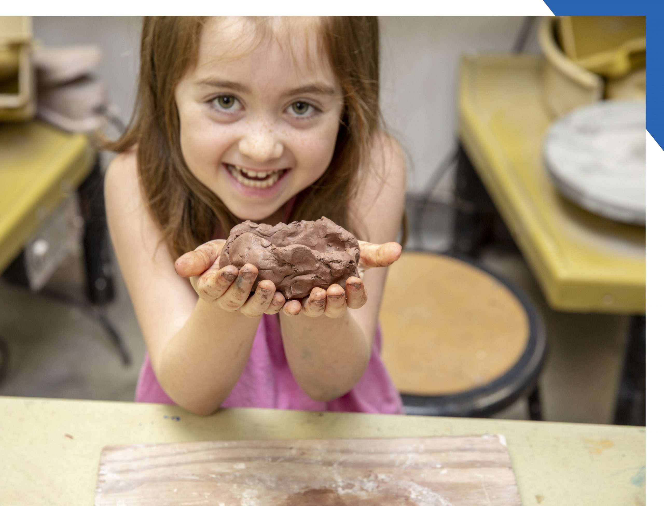 Child sculpting with clay