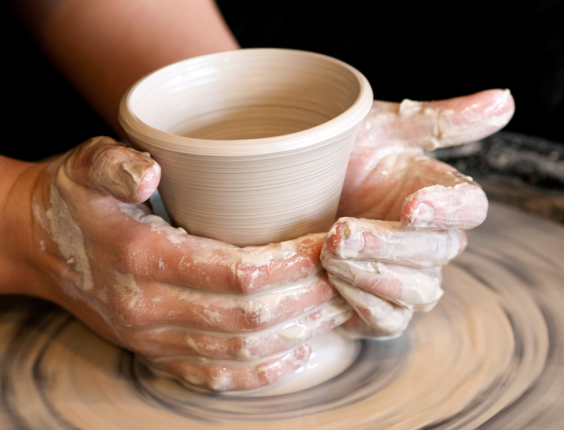 Hands creating ceramics