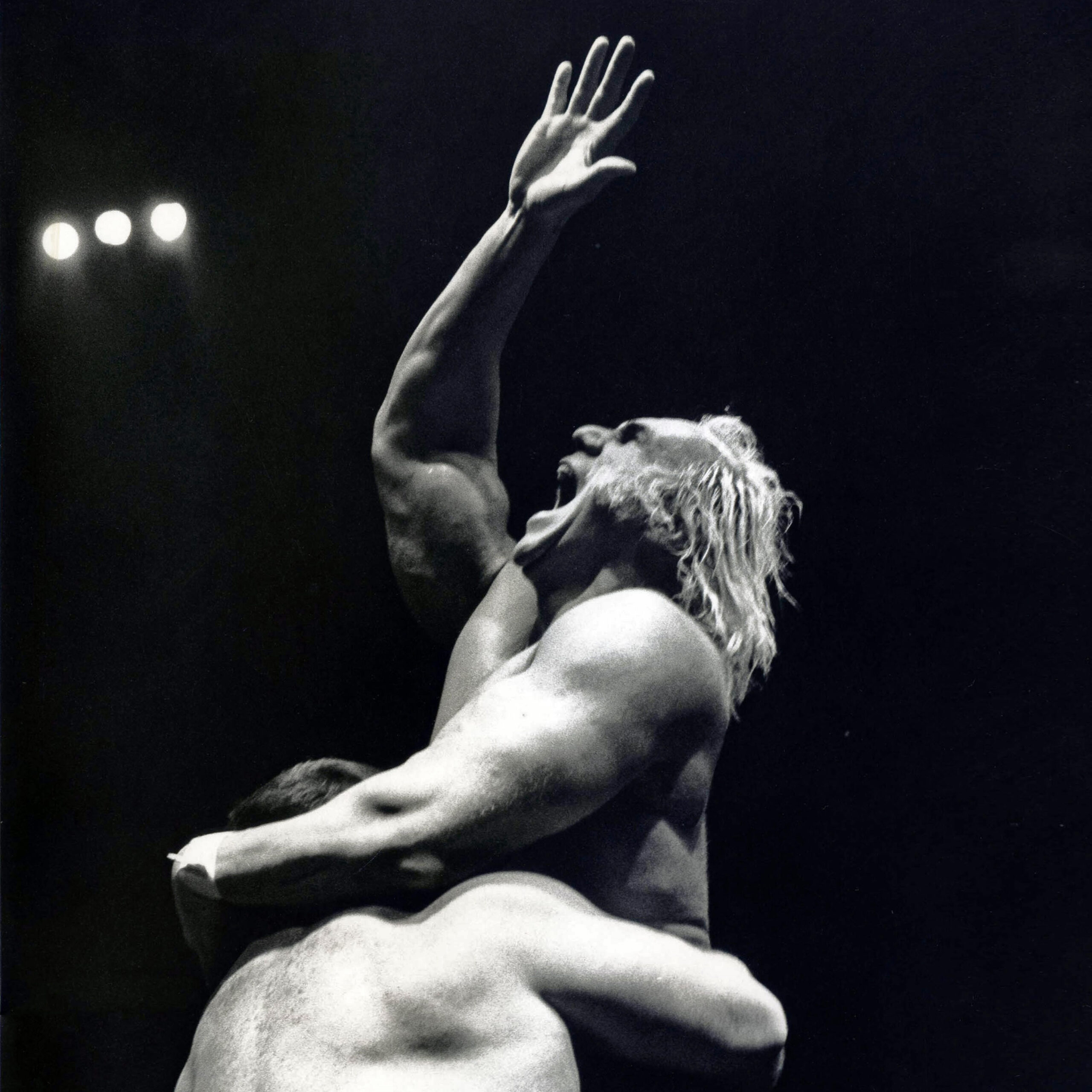 Superstar Billy Graham 2, 1977 Chromogenic print 10 x 8 inches. Shows two men, one holding the other up. The man on the top is yelling and holding his right arm up.