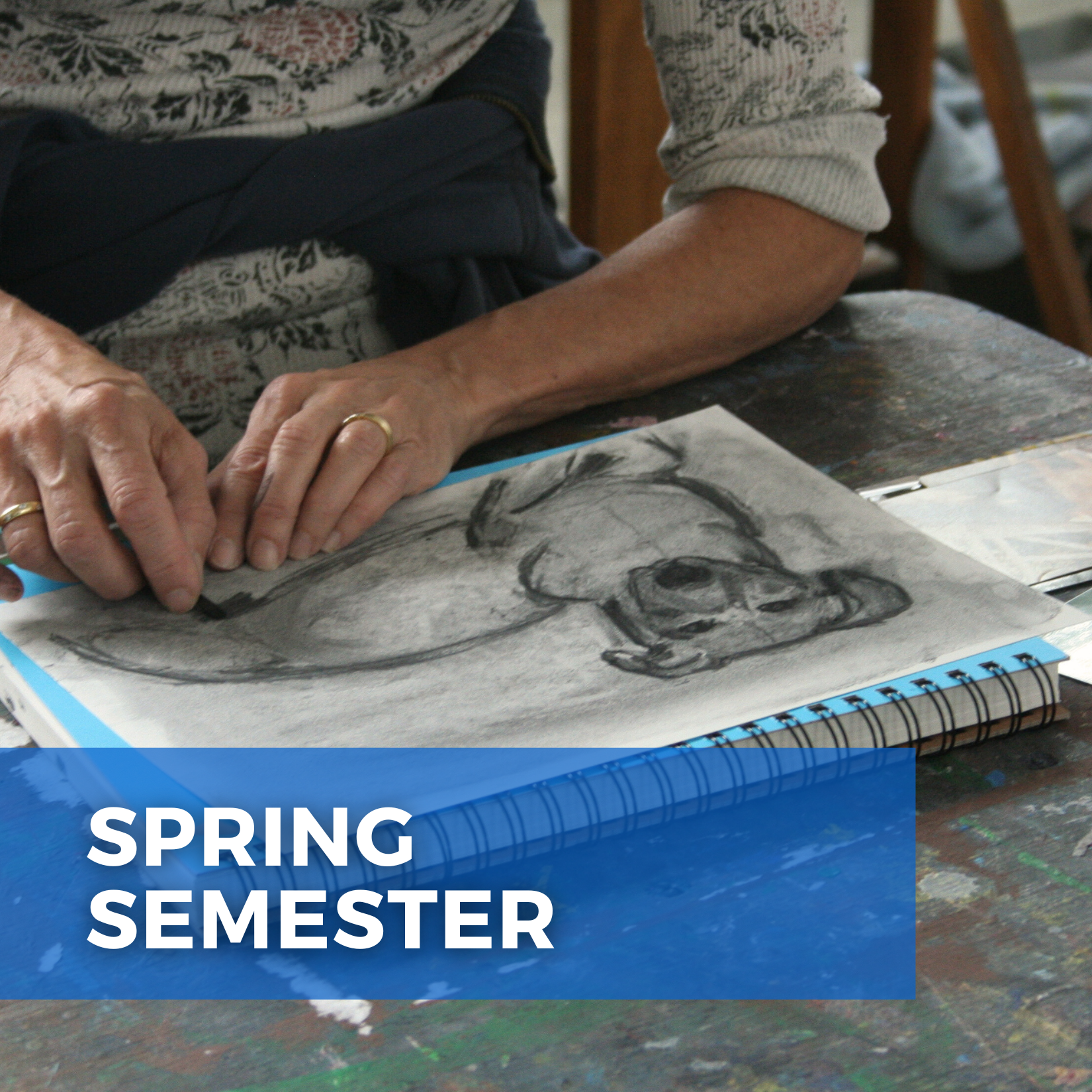 A closeup of an adult's hands working on a drawing. Text that says, "Spring Semester."