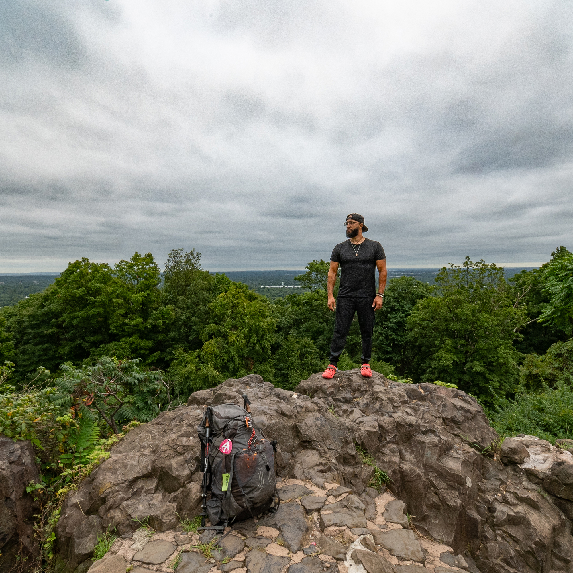 Brian standing at the top of a mountain under the guidance of Erik James Montgomery The Rock (ode to the location, and also to the planet we live on, the place we can’t ever truly escape during this lifetime). Inkjet print 24 x 30 inches Courtesy of the artist